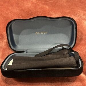 Gucci sunglasses case.